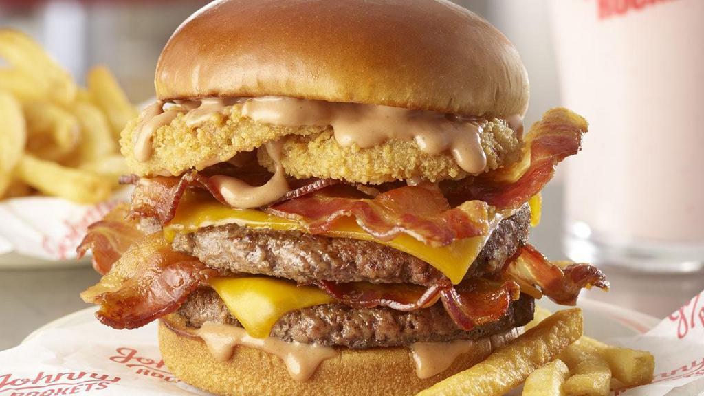 Smoke House Double · Rustle up double hunger for this burger featuring two 100% fresh, never frozen certified angus beef patties, grilled to perfection and topped with bacon, cheddar cheese, crispy onion rings and our homemade Smoke House BBQ Ranch.