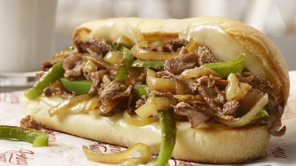 Philly Cheese Steak · Blast off to Philly in Rockets’ version of a classic featuring thinly sliced sirloin steak topped with caramelized onions, green peppers and melty provolone cheese.