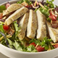 Grilled Chicken Club Salad · The classic sandwich, salad style featuring juicy grilled chicken breast on a bed of seasona...
