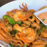 Fried Calamari · Seasoned and flash-fried with shrimp & shishito peppers served with sambal aioli.