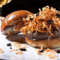 Black Label Burger · Eden’s premium signature beef stuffed with truffle onion confit topped with aged cheddar, cr...