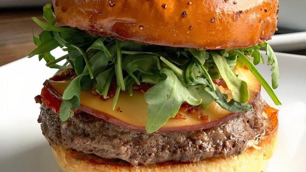 Fig · House blend Angus beef patty, sun-dried tomatoes crispy prosciutto flakes, smoked gouda, lemon basil aioli, fig and olive tapenade.