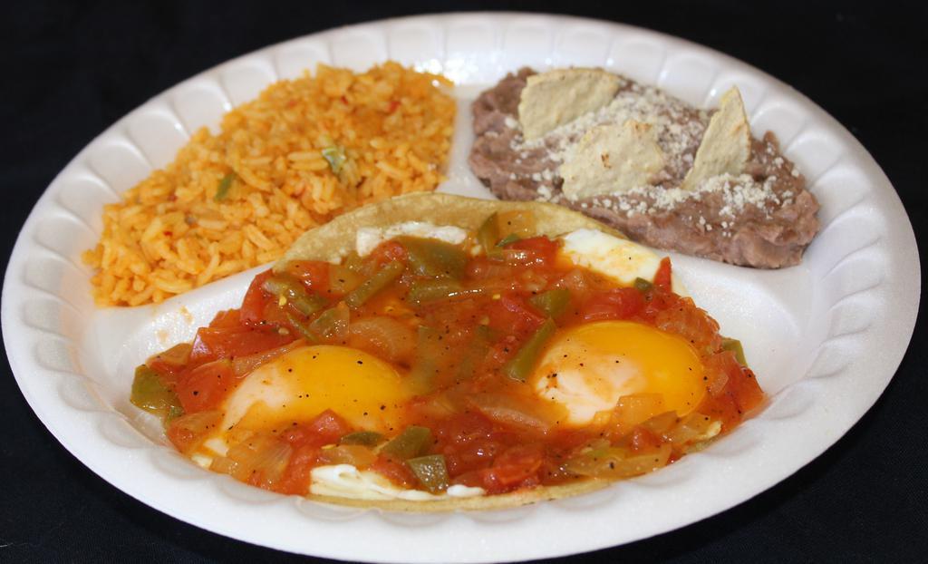 Huevos Rancheros · Two eggs sunny side up on a corn tortilla covered with ranchero sauce. Served with rice and beans.