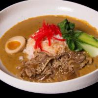 Beef Curry Over Rice Bowl · Thin cut sukiyaki beef, baby bok choy.