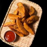 Potato Wedges Fries · Thick cut wedges french fries with garlic butter original sauce.