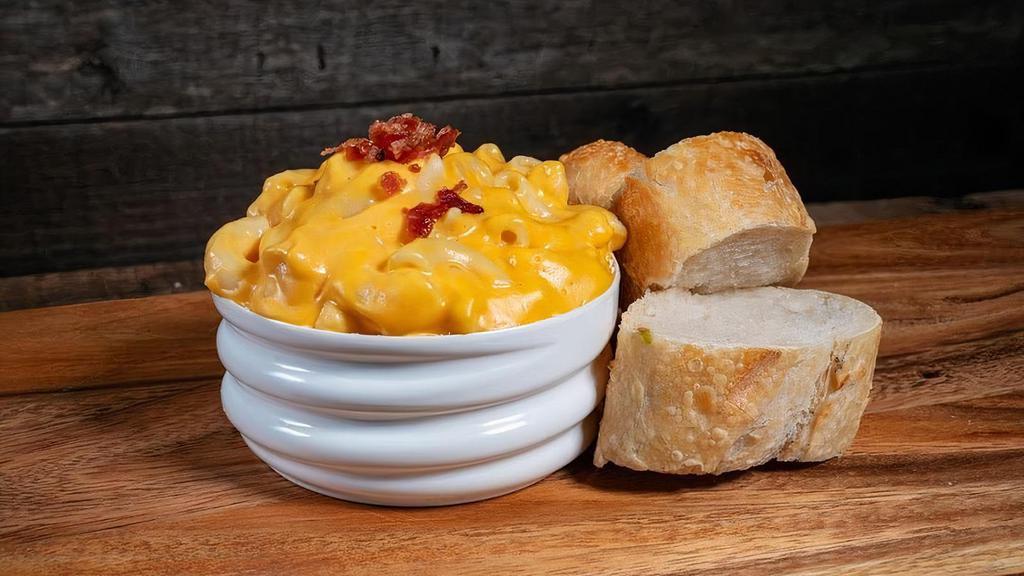 Mac & Cheese · Creamy Cheese Sauce & Macaroni noodles served with a side of Sourdough Bread
