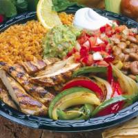 Chicken Fajita Plate · Served with rice, pinto or black beans, guacamole, sour cream, mild pico de gallo salsa, tor...