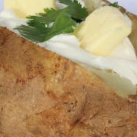 Baked Potato · Served with butter and sour cream on the side.