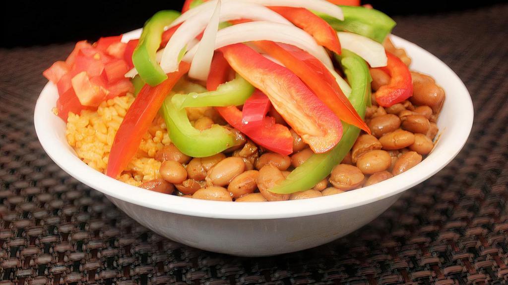 Fajita Veggie Bowl · Fajita veggies, rice, pinto or black beans, mild pico de gallo and your choice of protein.
