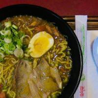 Curry Ramen · Soy sauce soup base with curry sauce, pork, spinach, bamboo shoots, corn,  battered onion, a...