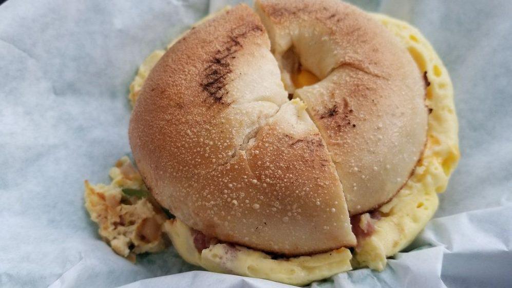 The Works Bagel · Egg on a bagel with tomato, bell peppers, and red onion