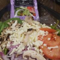 House · Mixed greens, tomatoes, red onion, mushrooms, mozzarella cheese, our own house dressing.