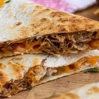 Carnitas Quesadilla · Large flour tortilla filled with cheese and freshly grilled carnitas!