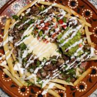 Large Birria Loaded Fries · Golden crispy fries loaded with birria topped with onions, cilantro, pico, guacamole, and so...