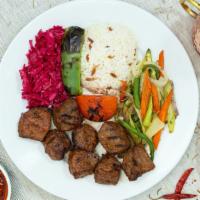 Lamb Shish Kebab (Cubes) · Tender cubes of lamb marinated in our special house sauce and char-grilled. 

Comes with ric...
