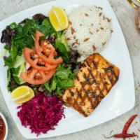 Fillet Of Salmon · Grilled fresh fillet of salmon topped with a marinated dill sauce. 

Comes with red cabbage,...