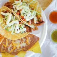 2 Fish Tacos · Soft corn tortillas with fried pollock, lettuce, pico, tartar sauce.
