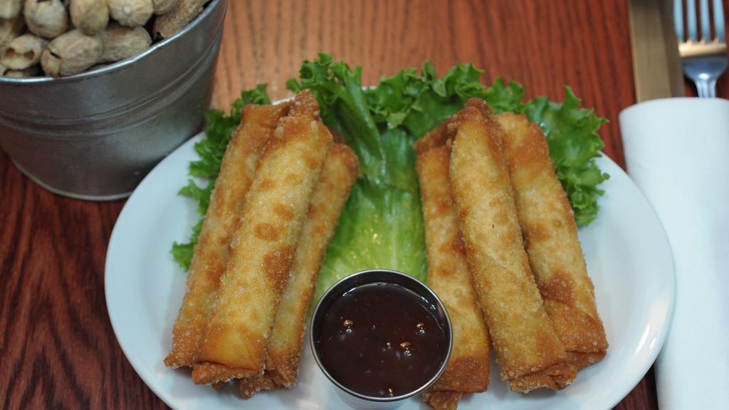 Texas Egg Rolls · Cream cheese blended with mixed cheese and diced jalapenos wrapped in a wonton skin. Served with Jalapeno Jelly