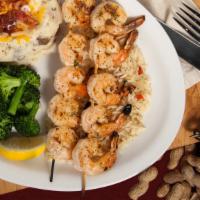 Mesquite Grilled Shrimp · Ten large shrimp skewered and seasoned with our special blend of spices. Served on a bed of ...