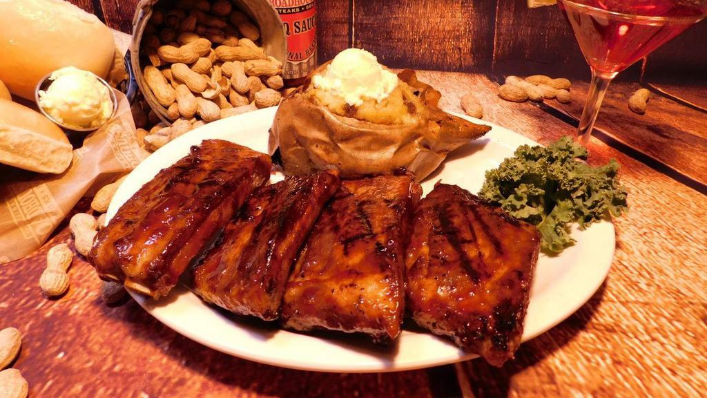 Louis Style Ribs · A generous portion of our meaty and tender ribs, cooked to perfection and finished with our famous Roadhouse BBQ sauce. Choose between a full or a half size portion.