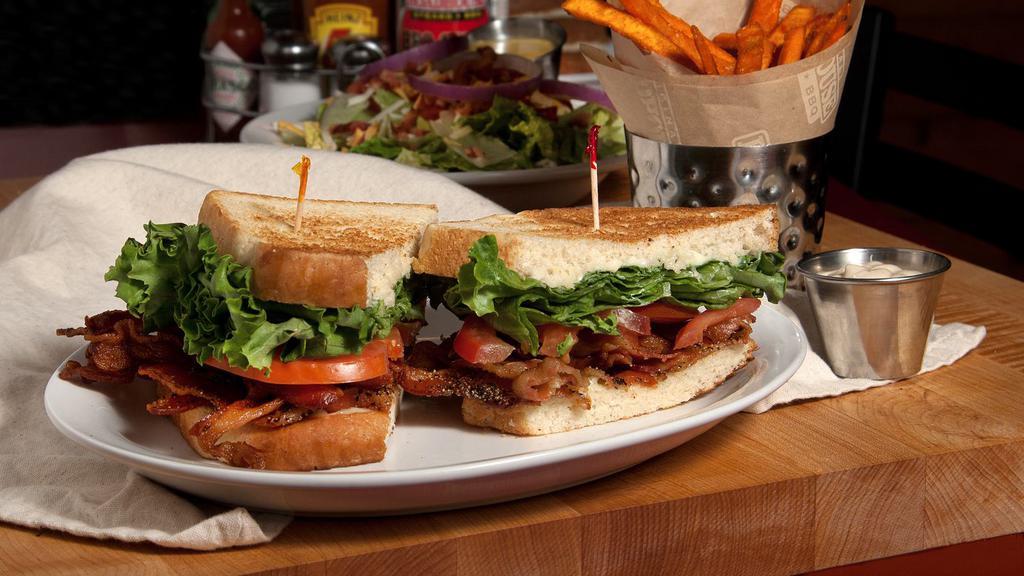 Roadhouse Blt · Traditional and signature brown sugar pepper crispy bacon piled high and topped with crisp lettuce, fresh tomato and mayonnaise. Served on toasted sourdough.
