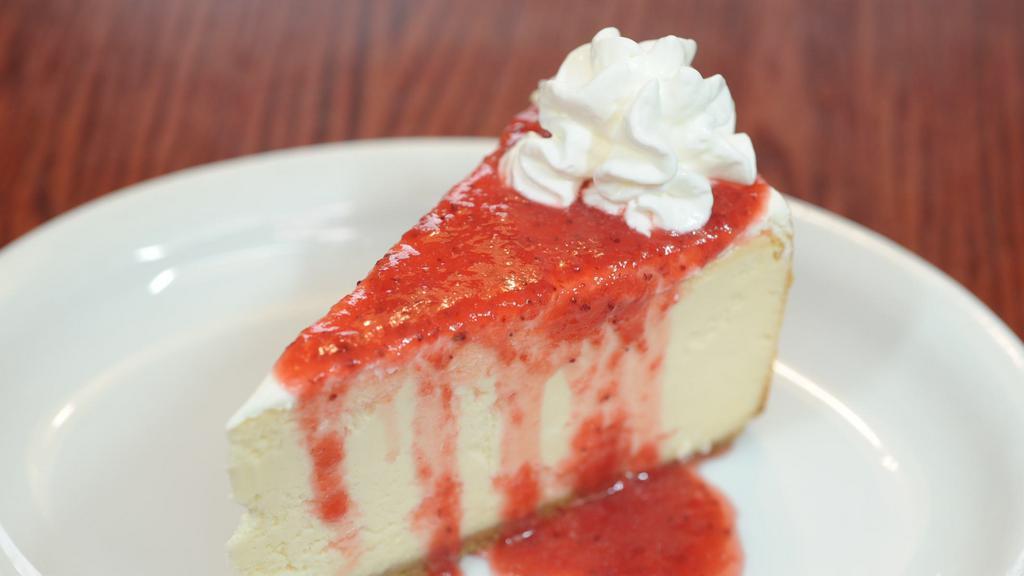 Original Roadhouse Cheesecake · Topped with your choice of strawberry, chocolate or caramel sauce.