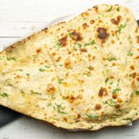 Garlic Naan · Tandoor baked garlic bread.