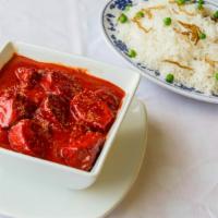 Chicken Tikka Masala · Boneless chicken cubes barbecued first in the tandoor and then cooked in a tomato based sauc...