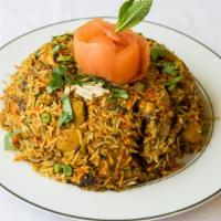 Chicken Biryani · Basmati rice favored with sa-ron, cooked with mil spiced chicken in an aromatic combination ...
