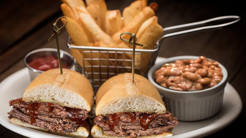 Bbq Tri-Tip Sandwich · Slow cooked and tender, basted with BBQ sauce and piled high on a soft French roll. Served with steak fries.
