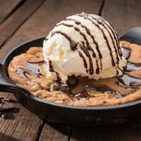 Cowboy Cookie · A freshly baked chocolate chunk cookie topped with vanilla-bean ice cream.