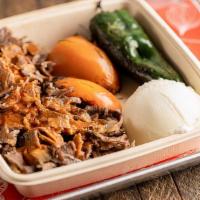 Iskender Kebab Plate · Iskender Kebab plate has Beef Doner Kebab sitting on top of a bed of Freshly Grilled Pita wi...