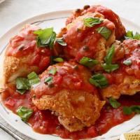 Chicken Cacciatore · Chicken cooked in a white wine sauce with roasted peppers and onions.