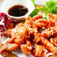 Sesame Chicken App · Marinated in sesames, ginger sauce and lightly fried.