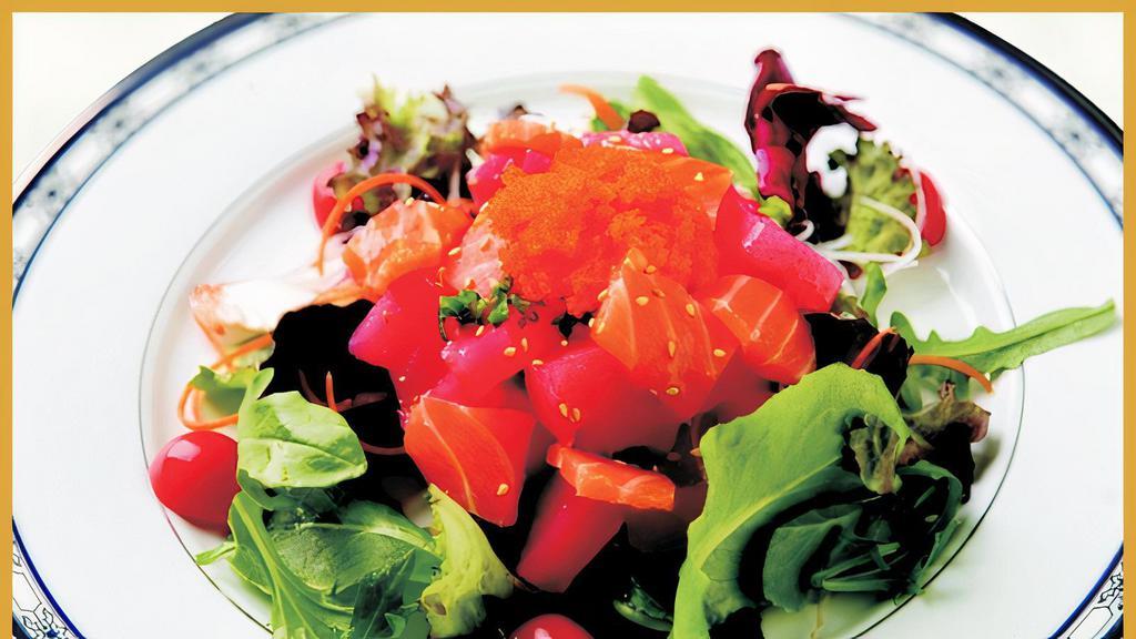 Sashimi Salad · Tuna, salmon, white fish cucumber and daikon on gourmet spring mix with house sauce and sesame oil.
