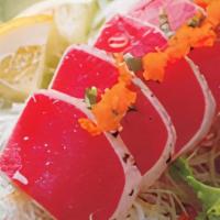 Seared Tuna Sashimi · Seared tuna, garlic, black pepper with masago, red onion and house sauce.