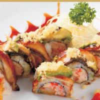 Dragon Roll · Spicy. Shrimp tempura, spicy tuna, crab and crunch with eel, avocado on top.