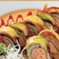 Eel & Avocado Roll · Meat with eel and avocado on top.