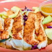  Milanesa Salad · Our homemade breaded chicken strips served on fresh spring mix and iceberg lettuce with avoc...