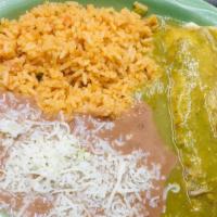 Chiles Rellenos A La Huasteca · Two green chiles stuffed with Jack cheese, cooked in a light egg white batter, and topped wi...