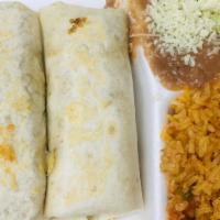 Burritos · Two small flour tortillas filled with chicken, beef, or pork, tomato and red or green sauce....