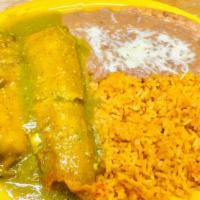 Tamales Regiomontanos · Two chicken or pork tamales topped with red or green sauce. Served with rice and beans.