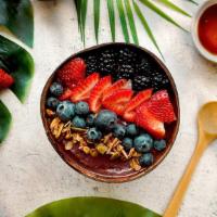 Bom Dia Berry Bowl · Acai bowl topped with blackberries, blueberries, strawberries, and honey.