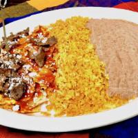 Chilaquiles · Red or green  crispy corn tortilla chips and egg scramble topped with asada or chorizo, fres...