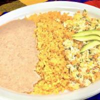 Huevos Mexicanos (Pico & Egg Scramble) · Pico de gallo and egg scramble with fresh avocado slices on top. Corn or flour tortillas.