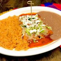 2 Enchiladas Plate · Red or green enchiladas with shredded cheese on top. Choice of shredded chicken, shredded be...