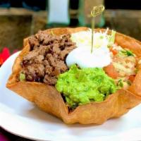Taco Salad Bowl · Flour tortilla crunchy style taco salad bowl. Choose asada pastor, shredded chicken or shred...