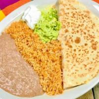 Quesadilla Jalisco · Shredded chicken, beef or asada. Plate includes rice, beans, guacamole and sour cream on the...