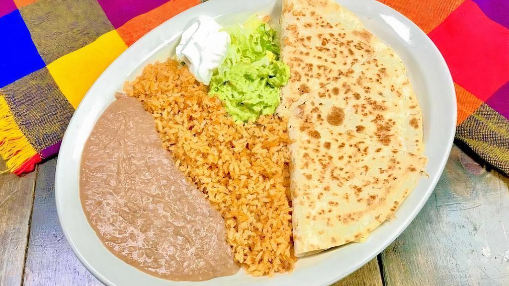 Quesadilla Jalisco · Shredded chicken, beef or asada. Plate includes rice, beans, guacamole and sour cream on the side.