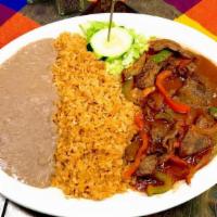 Bistek Ranchero · Thin cut pieces of grilled asada steak mixed with onions and bell pepper in housemade tomato...